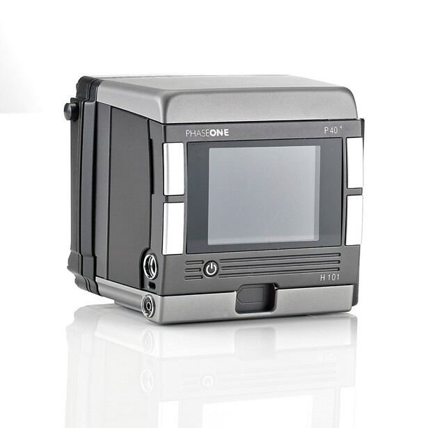 Phase One digital camera back with integrated LCD screen and control interface mounted on studio stand.