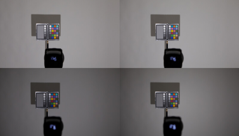 Four identical comparison shots of a color checker chart mounted on a wall above a black device, demonstrating consistent lighting conditions.
