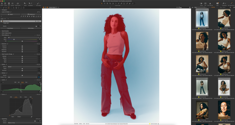 Woman in red clothing standing against a gradient blue background during a studio photoshoot.