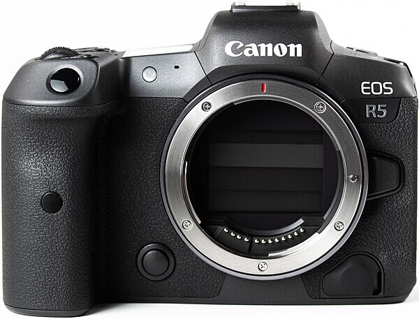 Canon EOS R5 mirrorless camera body shown from front without lens attached.
