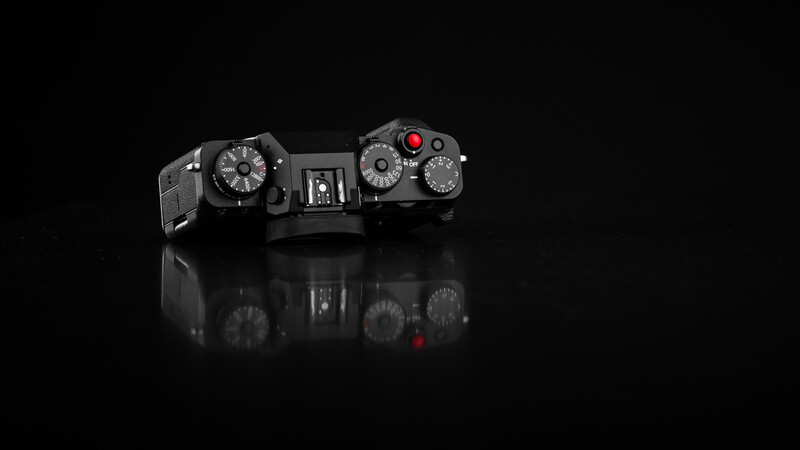Traditional Fujifilm dials are present as expected. A threaded shutter button allowed for a small red button to be installed.
