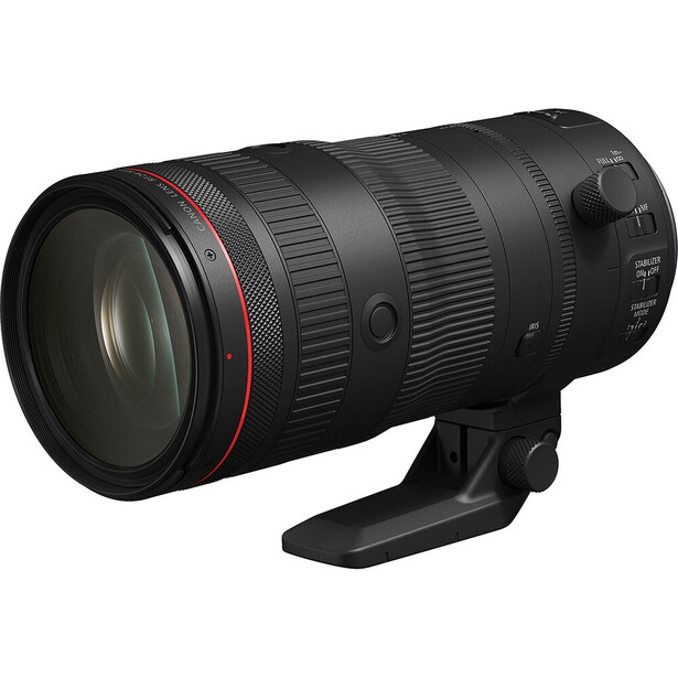Black telephoto zoom lens with red accent ring and focus controls mounted on tripod collar.