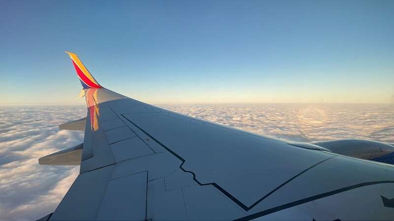 airplane wing over the US while traveling