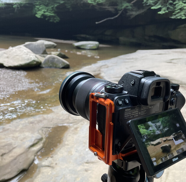 camera photographing a waterfall