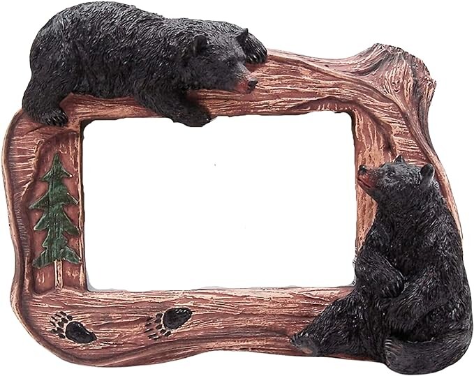 Decorative wooden picture frame with carved bears and forest details.