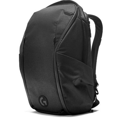 Black camera backpack with curved contoured design and side access panel against white background.