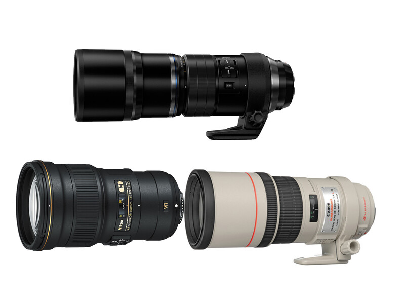 Three telephoto and zoom lenses arranged in a row against a white background.