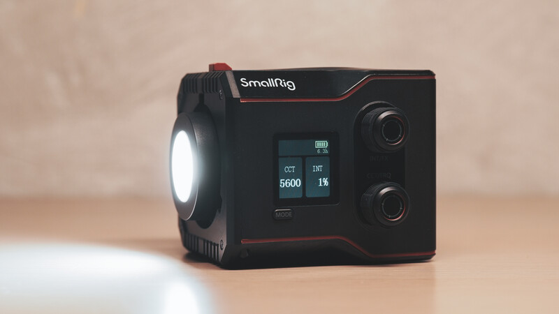 SmallRig compact LED light with front-facing circular reflector and control panel on neutral background.