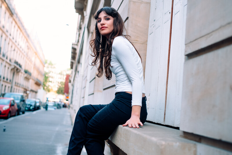 Model sitting on a window ledge.