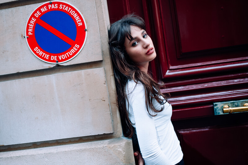 Model leaning on a wall.