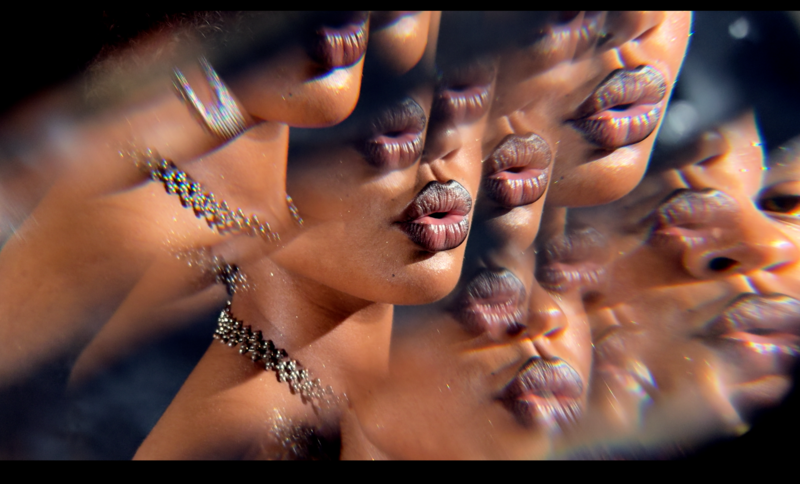 Multiple close-up portraits with dramatic warm lighting and mirror or prism effects creating layered facial reflections.
