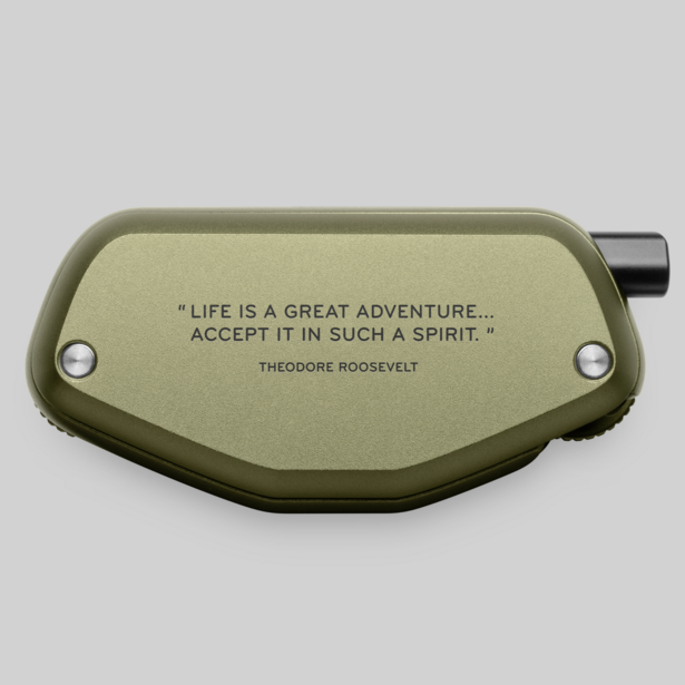 Olive green tactical pouch with Theodore Roosevelt quote engraved on the face and a black attachment loop on the right side.