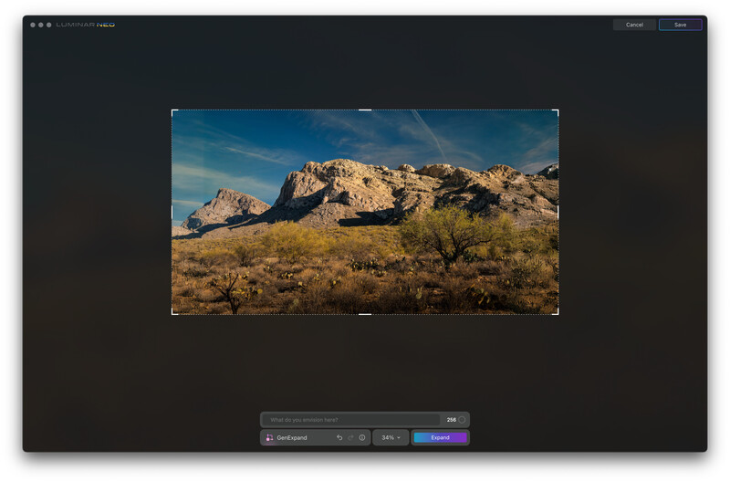 Screenshot of photo editing software showing desert landscape with rocky mountain formations under blue sky.