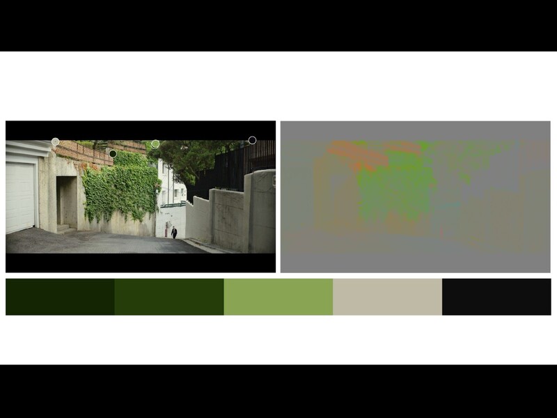Residential courtyard with white buildings, ivy-covered walls, and concrete barriers under natural daylight.