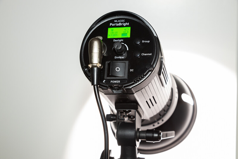 Overhead view of a studio flash with control panel and modelling lamp mounted on stand.