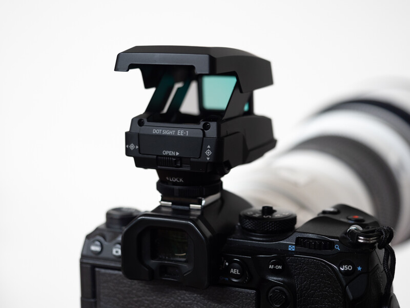 Electronic viewfinder mounted on top of a mirrorless camera body with lens attached.