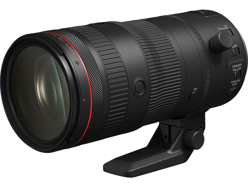 Black telephoto zoom lens with red accent ring and tripod collar foot mounted on white background.