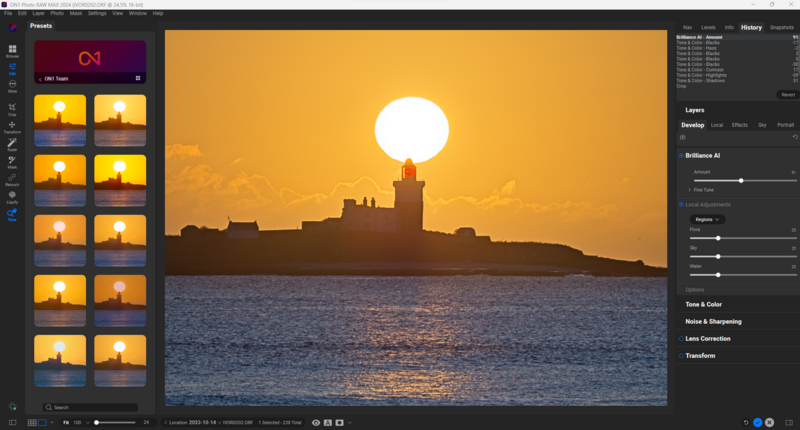 Screenshot of photo editing software showing a sunset landscape with silhouetted buildings and large sun reflecting on water.