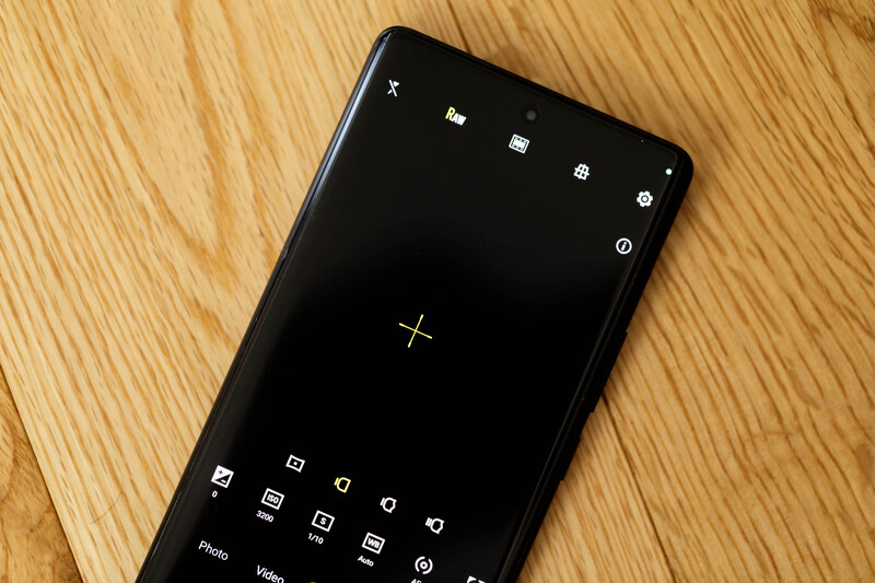 Screenshot of a smartphone camera app interface with manual controls displayed on a black screen.