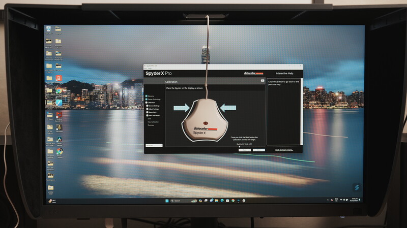 Screenshot of a 3D modeling software interface displaying a spherical microphone design with adjustment controls and a cityscape background.