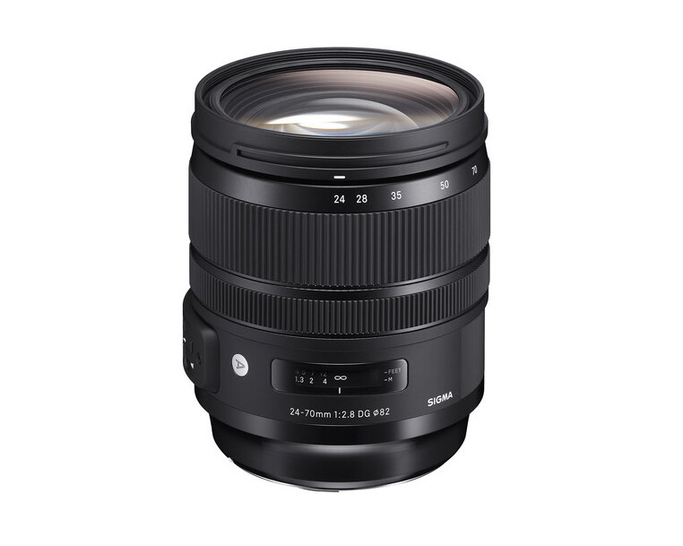 Sigma 24-70mm f/2.8 DG OS HSM Art lens with focus ring and aperture markings visible.