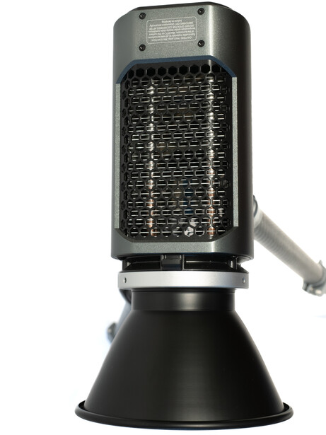 Studio flash unit with reflector mounted on a stand with adjustable arm.