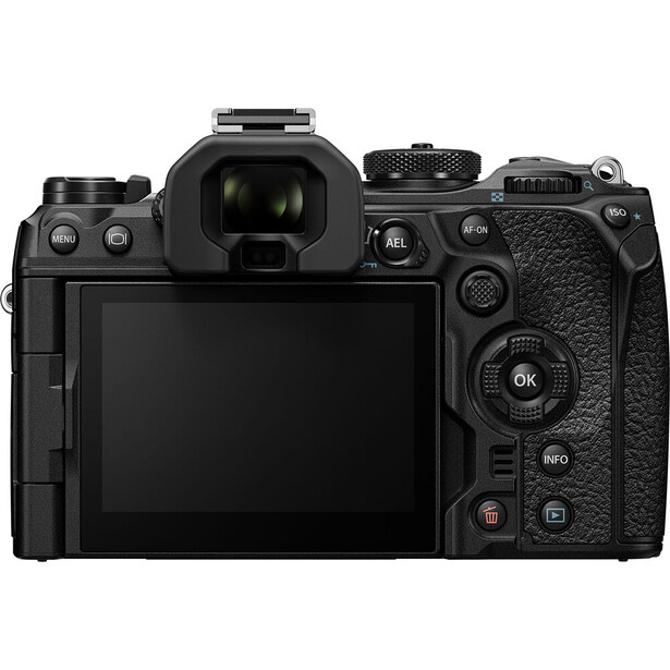 Rear view of a black mirrorless camera with articulating LCD screen and control dials.