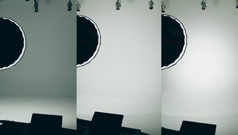 Three minimalist studio setups with circular black forms and pendant lights against white walls.