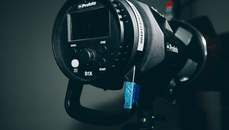 Profoto B1X monolight with display screen and controls visible in studio setup.