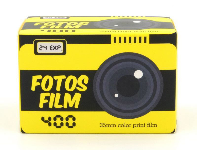 Fotos Film 400 vintage 35mm color film box with yellow and black striped design and lens illustration.