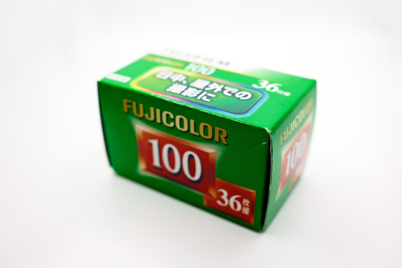 Fujicolor 100 film box with 36-exposure roll, green packaging with red label.