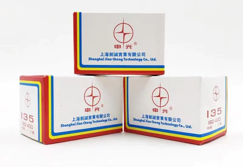 Product packaging boxes with colorful stripe borders and red cross logo for Shanghai Jiao Cheng Technology Co., Ltd.