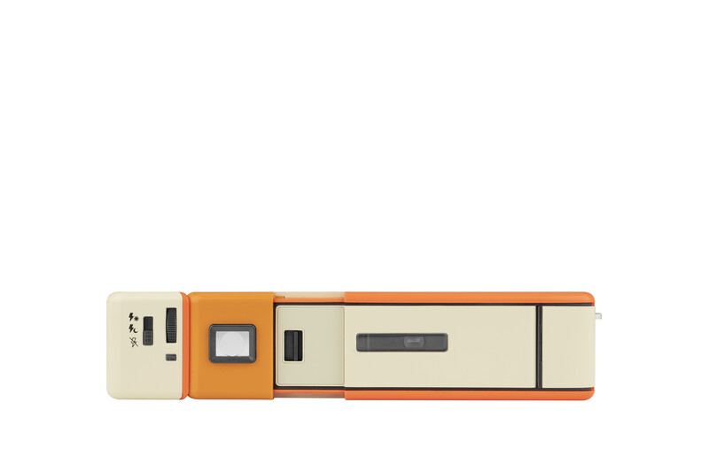 Illustration of a modular scanner or imaging device with beige, orange, and cream-colored segments arranged horizontally.