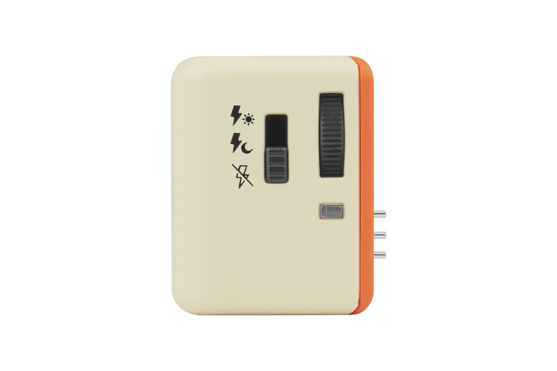 Illustration of a vintage control panel or device with cream and orange coloring, featuring Japanese characters, toggle switches, and indicator lights.