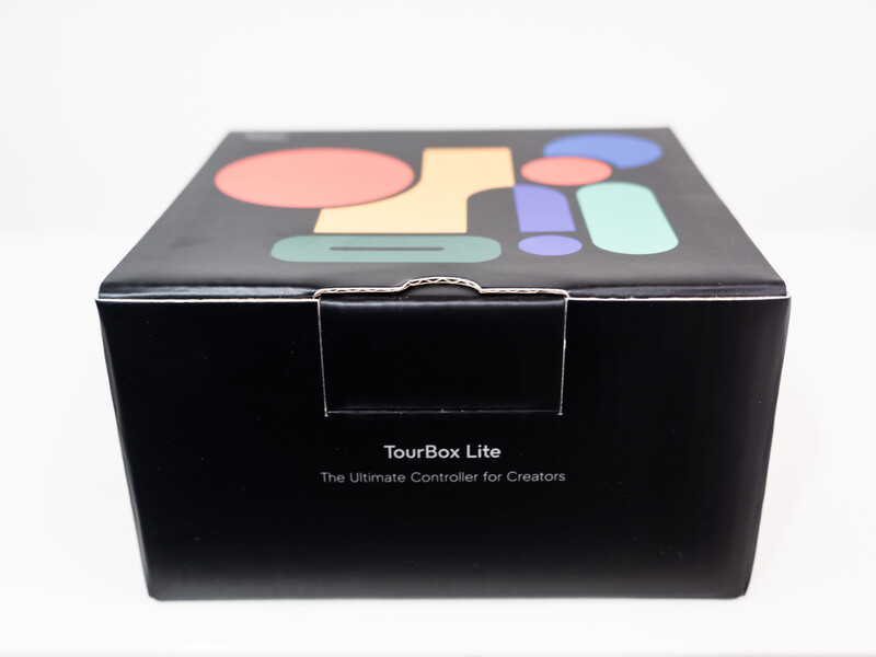 TourBox Lite controller box with colorful button layout displayed on dark packaging.