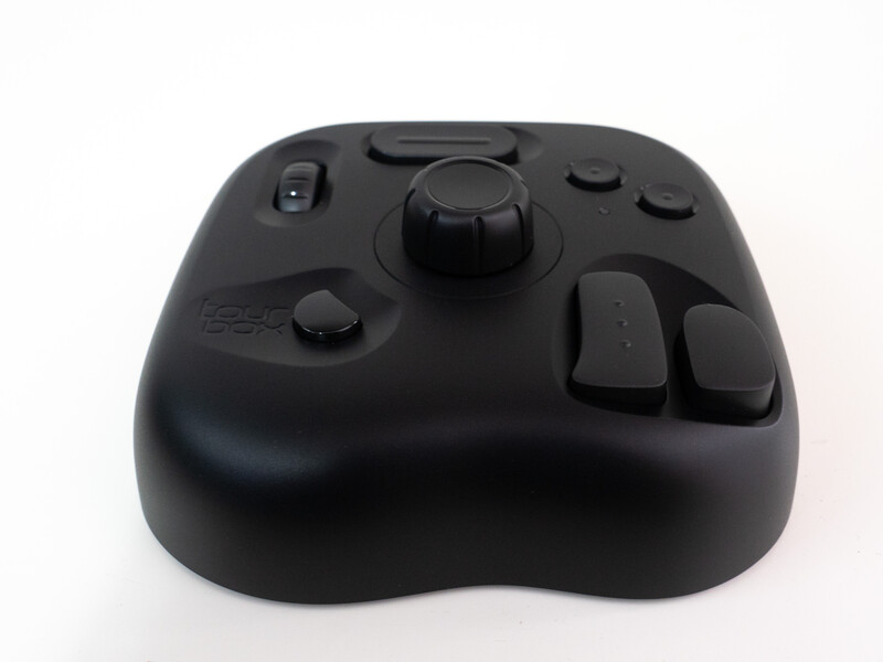 Black wireless game controller with analog stick, buttons, and shoulder controls on white background.