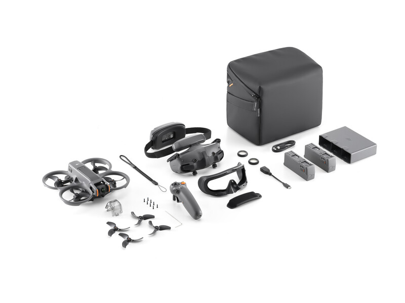 Drone with camera gimbal disassembled into component parts arranged on white background.
