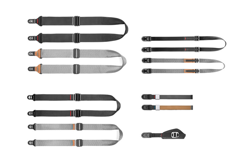 Collection of camera straps in various styles and colors arranged in three groups.