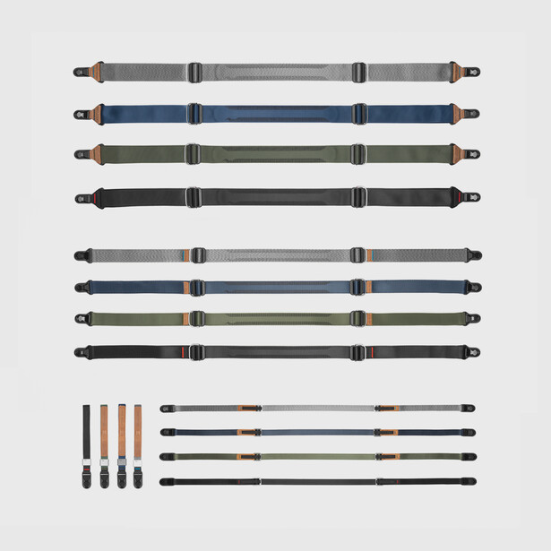 Illustration of eight camera straps in various colors and two sets of removable strap connectors.