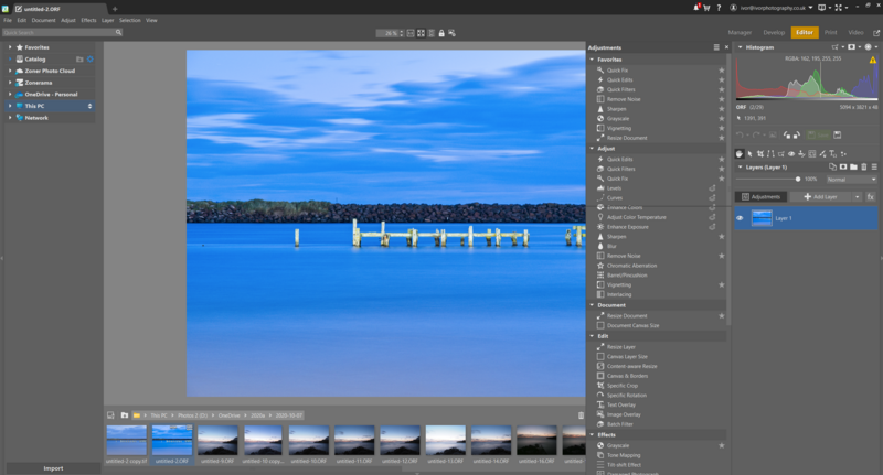 Screenshot of photo editing software displaying a coastal landscape with wooden pier and blue water.
