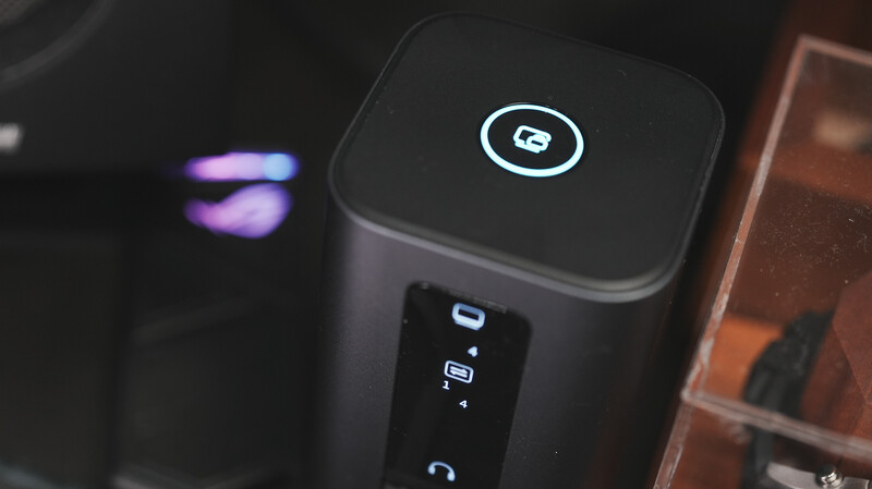 Desktop computer tower with illuminated power button and logo on top panel.