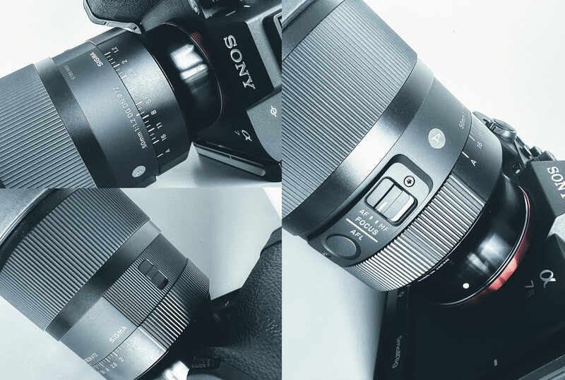 Sony camera body with multiple prime lenses arranged overhead on a light surface.