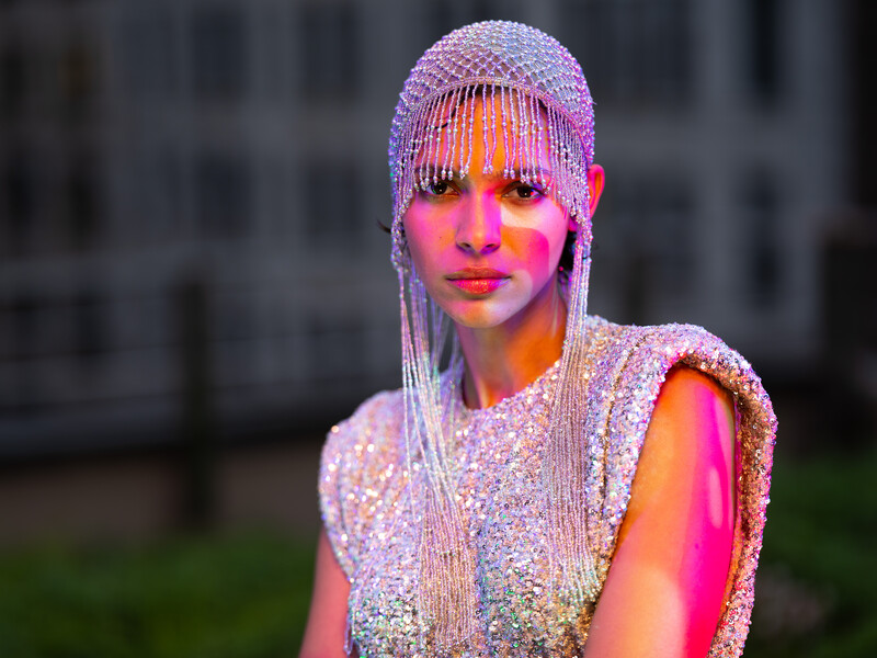 Model in silver dress on a rooftop