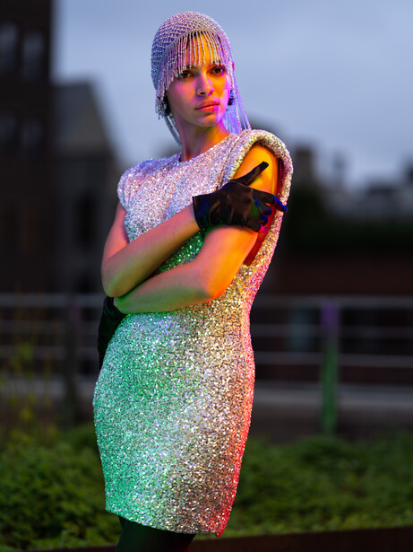 Model in silver dress on a rooftop