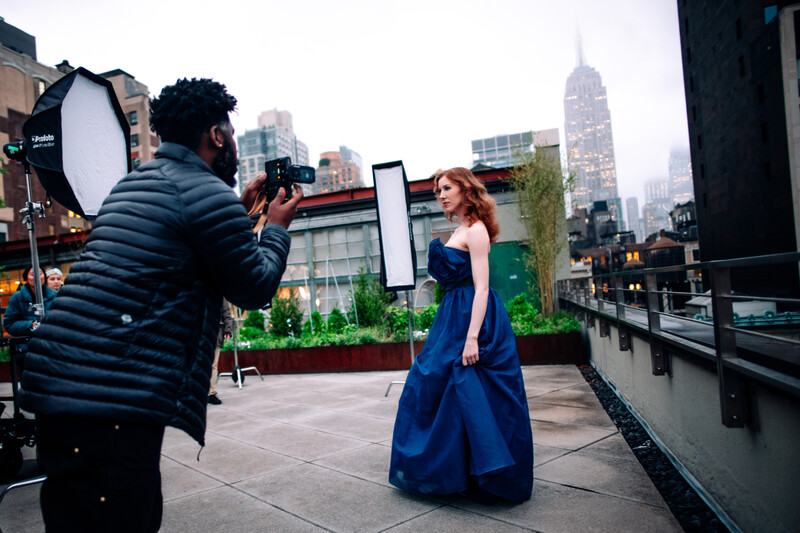 Model being photographed on a rooftop