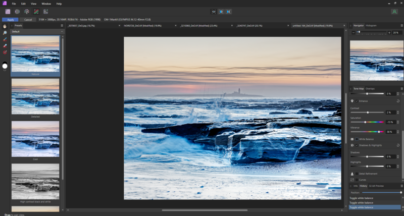 Seascape with breaking waves and rocky shore at golden hour sunset.