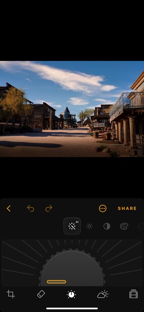 Screenshot of mobile editing interface displaying a western-style town street scene with mountains.