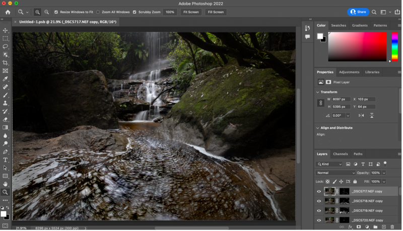Screenshot of Adobe Photoshop 2022 with a forest stream photograph open in the editor.