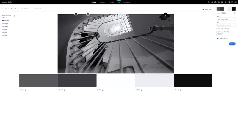 Upward view of a spiral staircase with dramatic architectural lines and lighting.