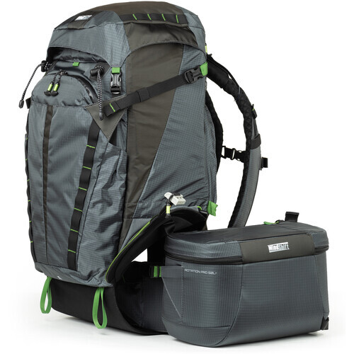 Gray and black hiking backpack with detachable bottom camera bag and green accent straps.